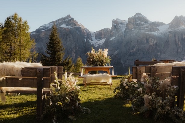 Ceremony setup at Col Pradat Hütte with the Dolomite peaks behind